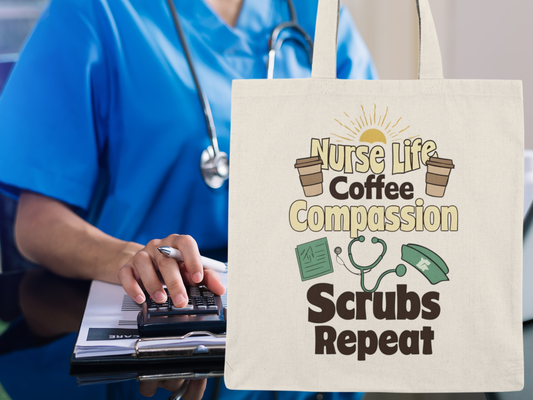 Tote bag with 'Nurse Life Coffee Compassion Scrubs Repeat' design held by a person in blue scrubs.